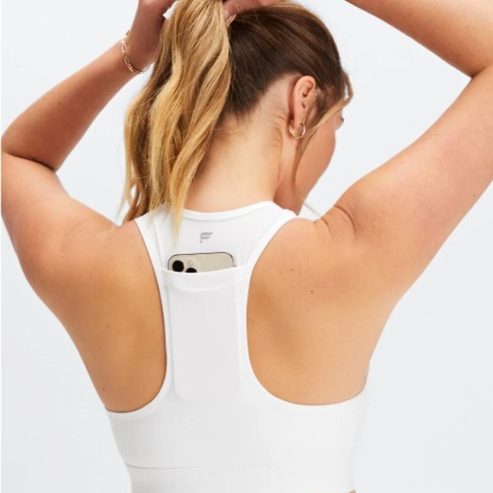 Fabletics On-The-Go Medium Impact Sports Bra | Racerback | White | XXS
